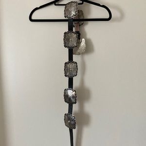 Sliver and black western belt